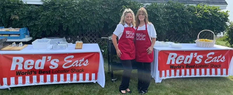 Red's Eats team members in aprons at a catering event